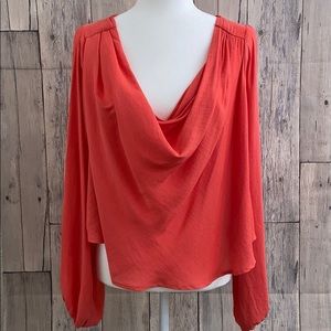 Free people orange blouse.